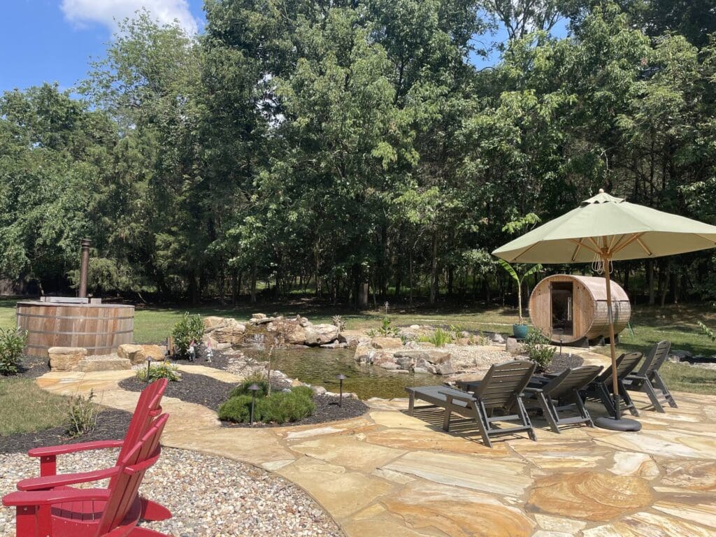 Large ecosystem pond with patio seating